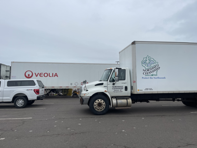 two large semi-trucks for hauling hazardous waste.